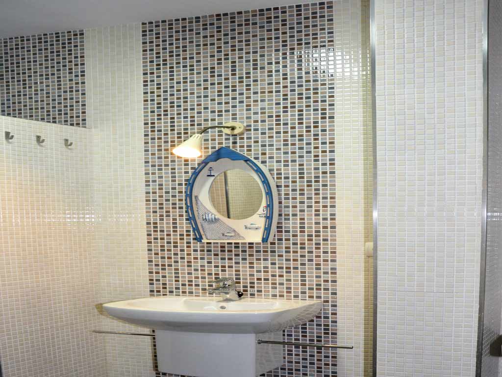 villa in Sitges with a bathroom with mirror.